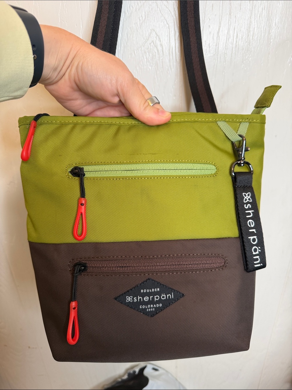Sherpani Sadie Olive and Brown Crossbody Bag with Orange Accents